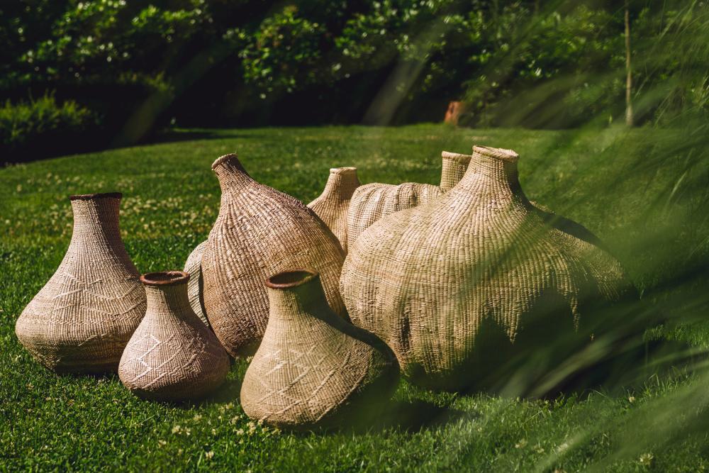 Handwoven Garlic Gourd Basket! Made by skilled Ndebele women weavers in Zimbabwe, each basket is one-of-a-kind and supports their livelihood. These decorative baskets are perfect for adding natural materials to your interior.