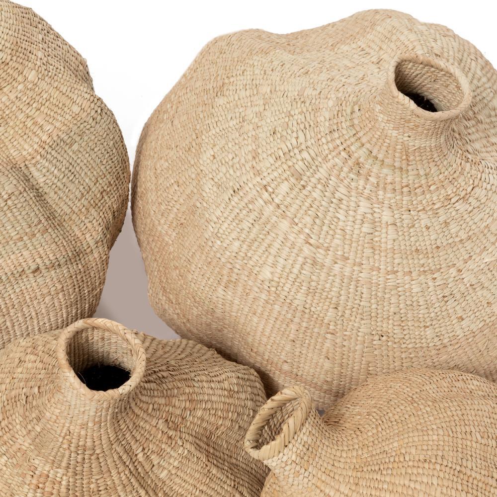 Handwoven Garlic Gourd Basket! Made by skilled Ndebele women weavers in Zimbabwe, each basket is one-of-a-kind and supports their livelihood. These decorative baskets are perfect for adding natural materials to your interior.