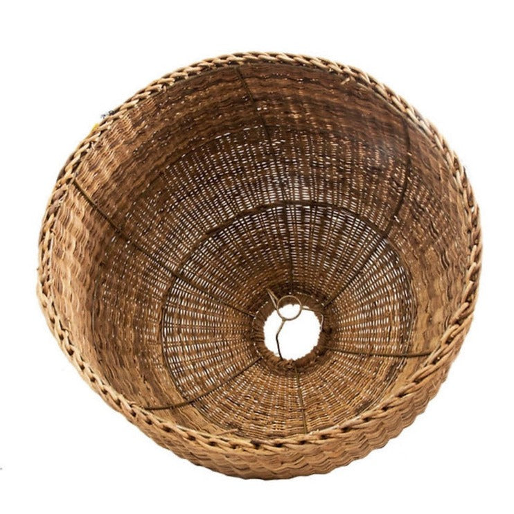 Handwoven Malawi rattan lampshade blends exquisite design with intricate detail. Enhance your space with its unique texture and enjoy the beautiful, softly dappled light.