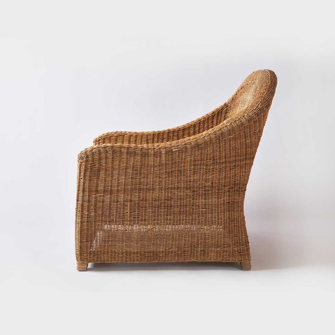 Relaxed and premium single seater cane couch.