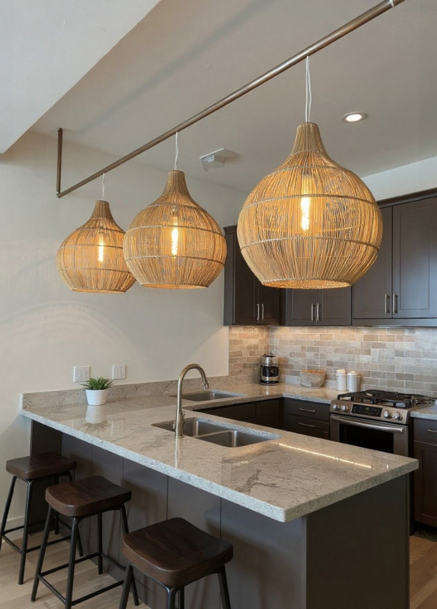 3 Bell shaped Malawi Cane Woven lampshades in a kitchen