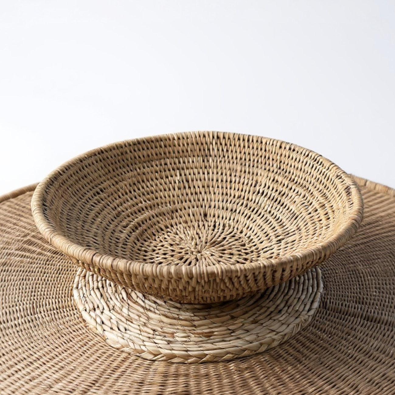 the Buhera Dish elevates any space with its natural charm and functionality. Whether used as a decorative accent or for storage, it adds an organic touch to your home. Perfect for everyday items and throws, displaying on a wall, or holding fruits and vegetables, the Buhera Dish is a stunning addition to your home.