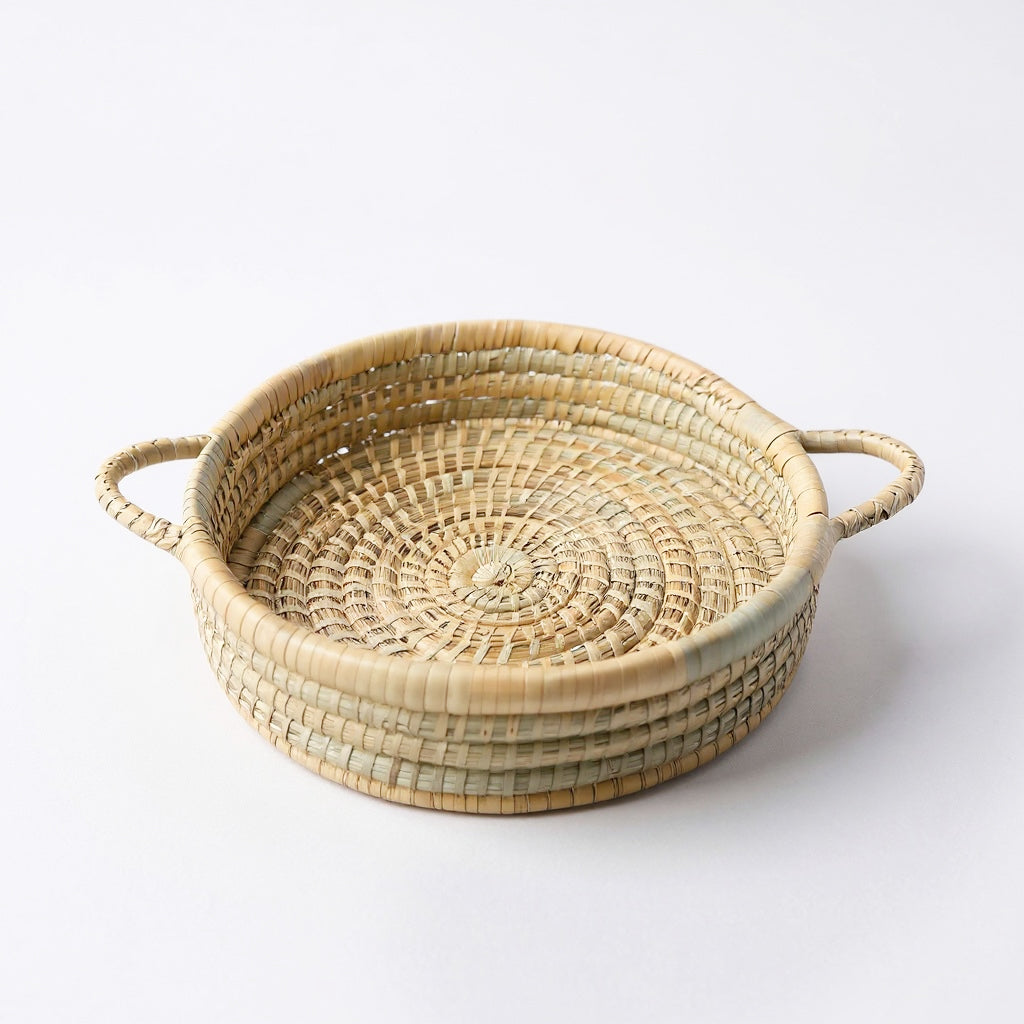 Handwoven Malawian Karula Cane Trays with handles made from ilala palm. Available individually or as sets of 3 from Malawi Furniture. Perfect for storage, serving or decor.