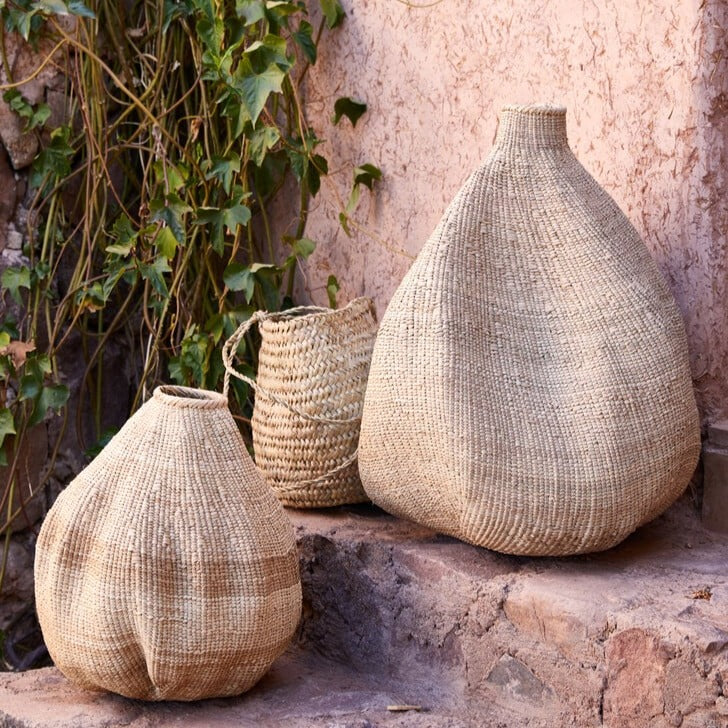 Handwoven Garlic Gourd Basket! Made by skilled Ndebele women weavers in Zimbabwe, each basket is one-of-a-kind and supports their livelihood. These decorative baskets are perfect for adding natural materials to your interior.