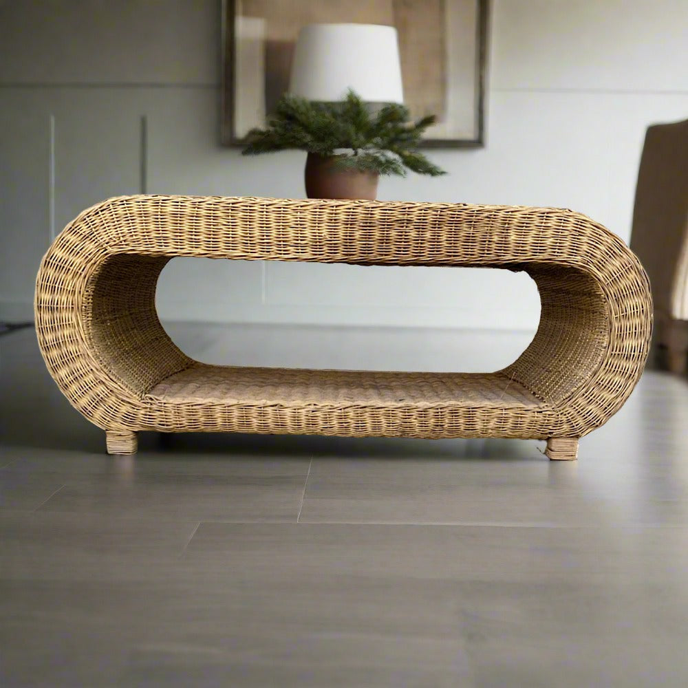 Beautifully crafted rounded coffee table. Its intricate weave patterns and natural textures bring warmth and character to any lounge, creating a focal point that sparks conversation and admiration. Perfect for both intimate gatherings and casual lounging, this coffee table is more than just furniture; it's a statement of style and appreciation for artisanal Malawi cane tradition.