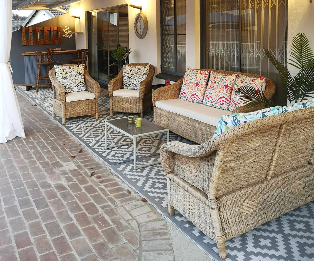 Classic one seater Malawi couch set with cushions at a happy customers home.