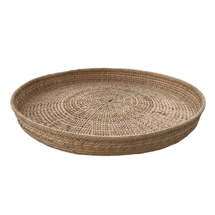 handwoven Round Trays, highly sought-after for their charm and craftsmanship, add an element of elegance and grace to any space. Crafted from ilala palm in Zimbabwe, these shallow trays serve as versatile storage solutions, perfect for kitchens, dining tables, bathrooms, or as striking wall accents, seamlessly blending functionality with aesthetic appeal. These catch-all trays are great for display or for storing everyday items such as keys, remotes or magazines.