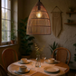 Tall Beehive Lampshade of a round dinner table in the evening