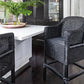 Classic Malawian cane bar stool Chair painted black in A Modern and chick homely Space.