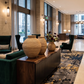 Malawian Buhera baskets with flower bouquet in premium hotel lobby.