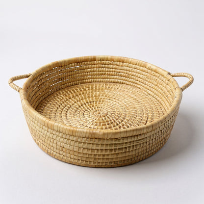 Handwoven Malawian Karula Cane Trays with handles made from ilala palm. Available individually or as sets of 3 from Malawi Furniture. Perfect for storage, serving or decor.