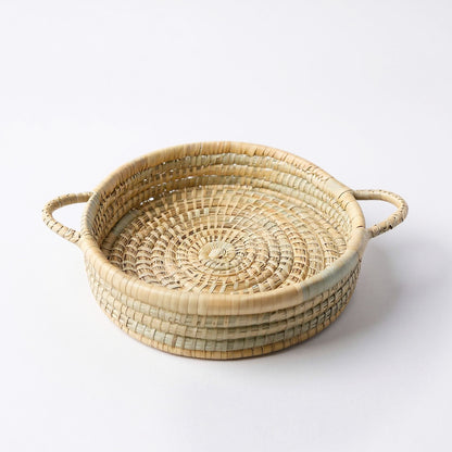 Handwoven Malawian Karula Cane Trays with handles made from ilala palm. Available individually or as sets of 3 from Malawi Furniture. Perfect for storage, serving or decor.