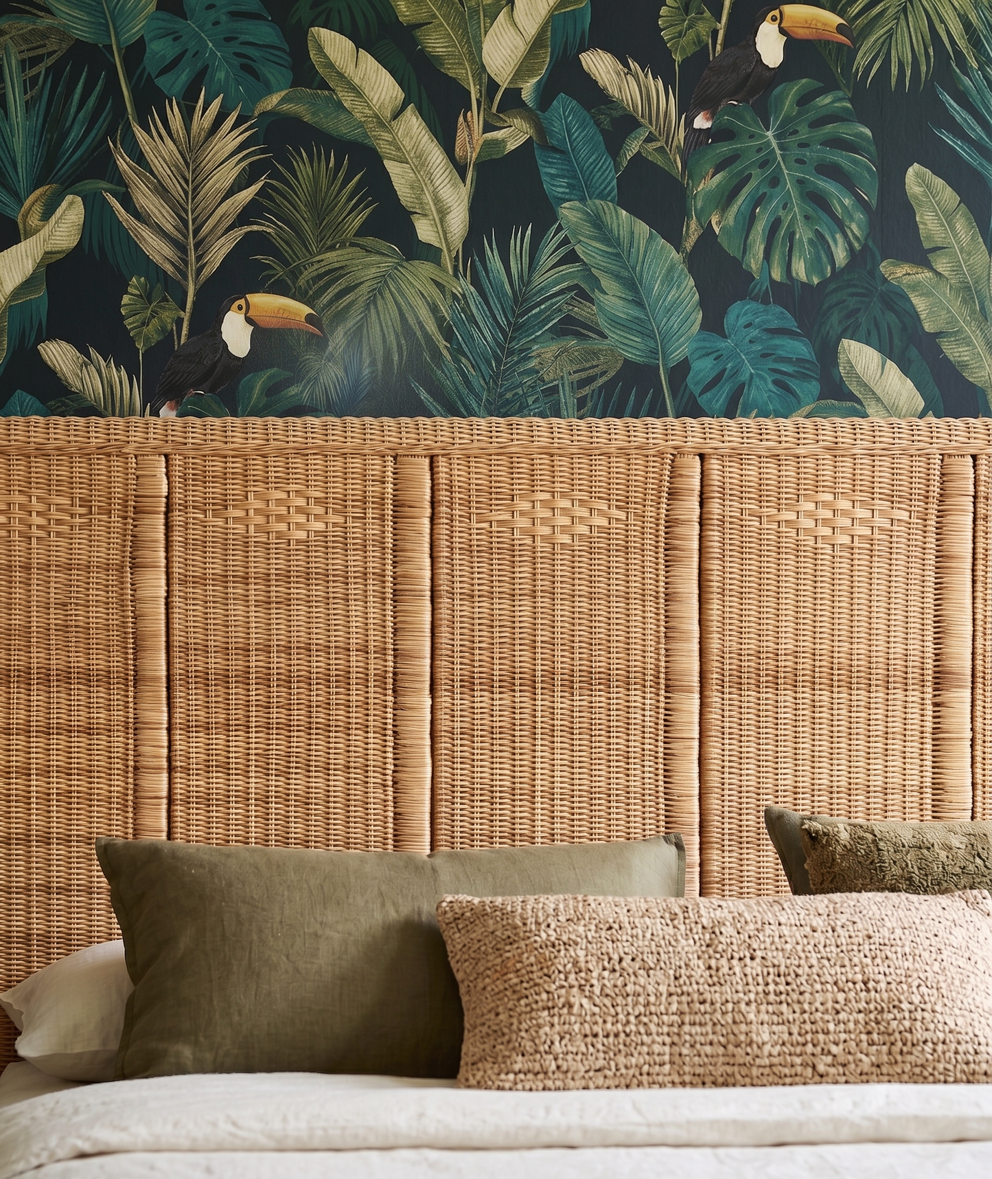 Authentic and textural solid headboard made from Malawi cane. Headboard adds lightweight, organic texture to any bedroom. Paired with vivid tropical wallpaper.