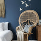 Malawi Furniture - Peacock Chair in blue bedroom with natural tones