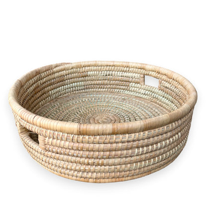 Large artisanal ilala palm round cane trays from Malawi Furniture. Available as singles or a set of 3.