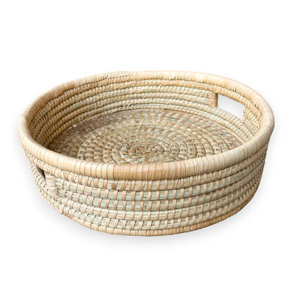Medium artisanal ilala palm round cane trays from Malawi Furniture. Available as singles or a set of 3.