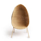 Standing EGG Chair — A handcrafted, egg-shaped chair woven from natural Malawian cane, featuring an elegant cocoon silhouette that rests on a sleek, four-legged metal stand. The chair includes a removable plush cushion (available in natural, white, or black) that enhances comfort and style. This artisanal piece combines organic textures with modern minimalism, making it a striking focal point for both indoor and outdoor spaces.