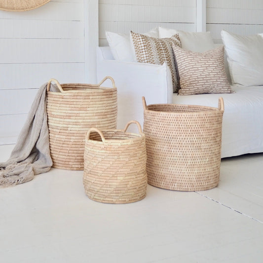 Experience both function and beauty with our Planter Baskets, handwoven from the ilala palm. With a variety of sizes and weave options, you are sure to find the perfect natural storage and container pieces for your home. Whether for blankets, laundry, plants, or toys, these baskets keep your space organised and stylish.