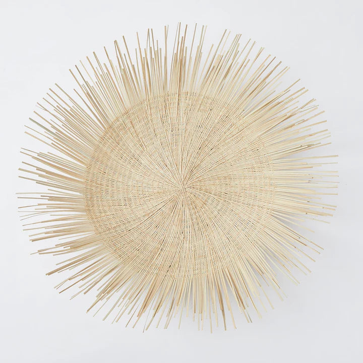 Handcrafted Sun Circle wall art. Each piece is carefully woven by Malawian craftsman, incorporating unique spikes and tendrils of ilala palm. Bring natural texture and a touch of bohemian style to your home or office!