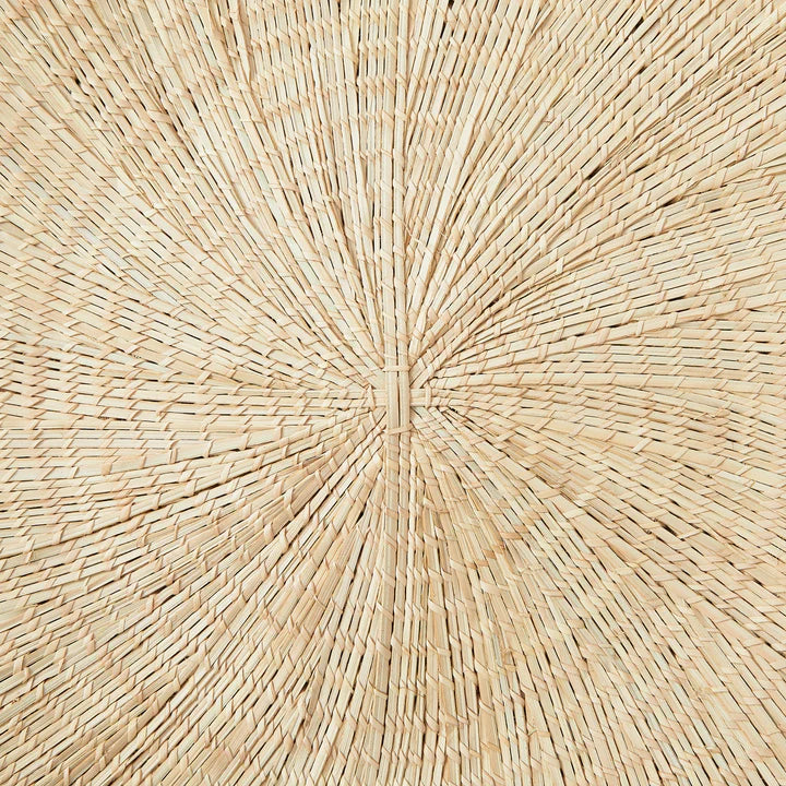 Handcrafted Sun Circle wall art. Each piece is carefully woven by Malawian craftsman, incorporating unique spikes and tendrils of ilala palm. Bring natural texture and a touch of bohemian style to your home or office!