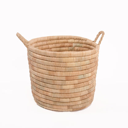 Experience both function and beauty with our Planter Baskets, handwoven from the ilala palm. With a variety of sizes and weave options, you are sure to find the perfect natural storage and container pieces for your home. Whether for blankets, laundry, plants, or toys, these baskets keep your space organised and stylish.