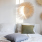 Handcrafted Sun Circle wall art. Each piece is carefully woven by Malawian craftsman, incorporating unique spikes and tendrils of ilala palm. Bring natural texture and a touch of bohemian style to your home or office!