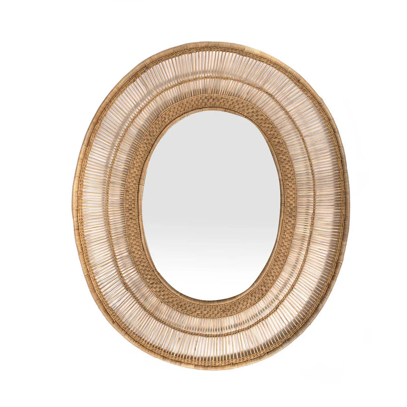 hand-woven cane and bamboo mirror. Crafted by skilled artisans, this exquisite oval piece is perfect for adding a touch of rural charm to any living space. Use it as a unique focal point or mix and match it with other decorative items. Please note: The frame is handmade in Malawi and strengthened in the UK for durability. The mirror is securely fastened using backing board and twine.