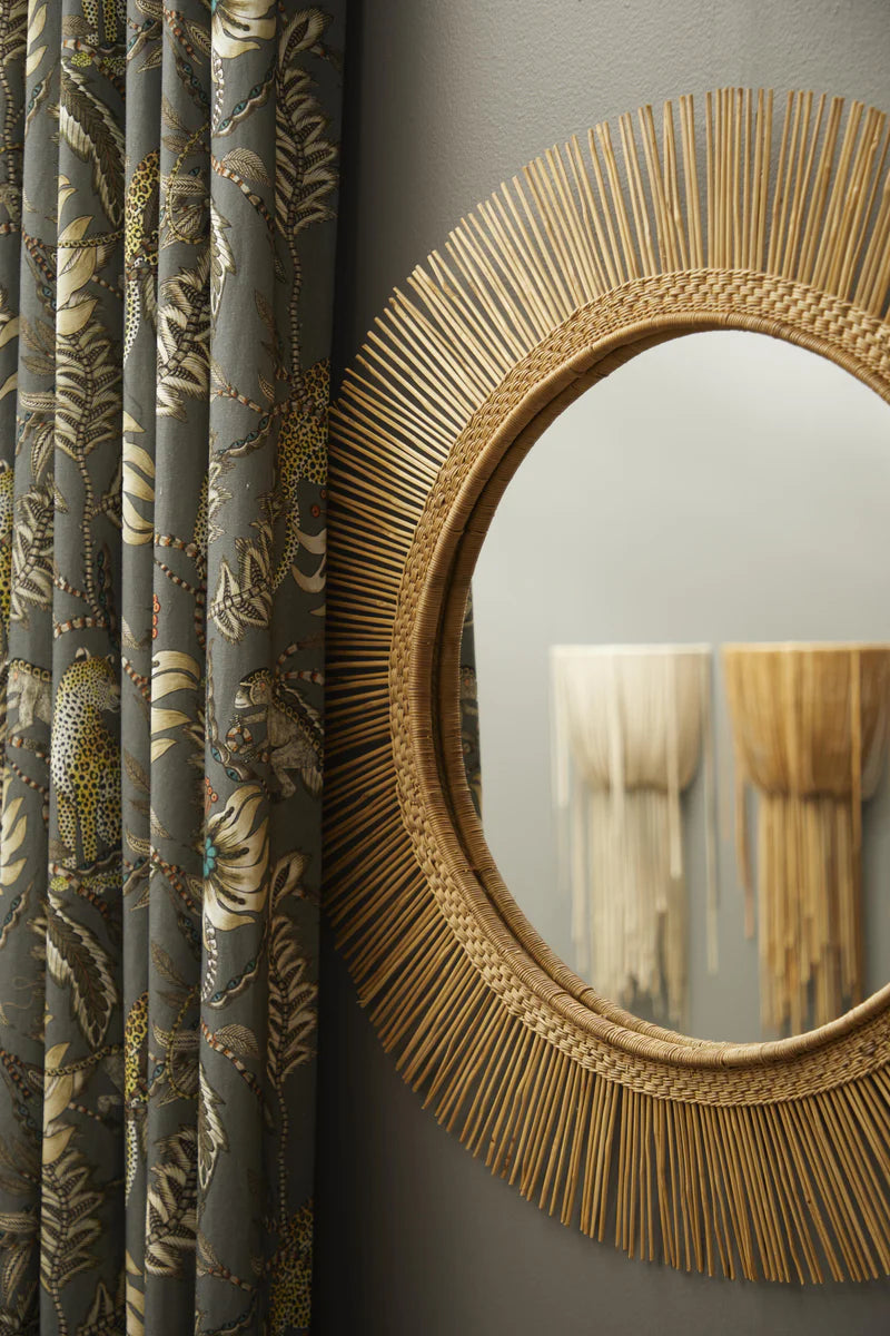 This Malawi mirror captures the essence of the rising sun and makes for a stunning addition to any living space. Crafted with care from rattan and bamboo, it takes inspiration from the iconic Malawi Chair. The intricate frame showcases a fusion of indigenous craftsmanship and Scandinavian sophistication, making it a must-have piece. The mirror comes with a wireframe for easy hanging and is ready to be displayed.