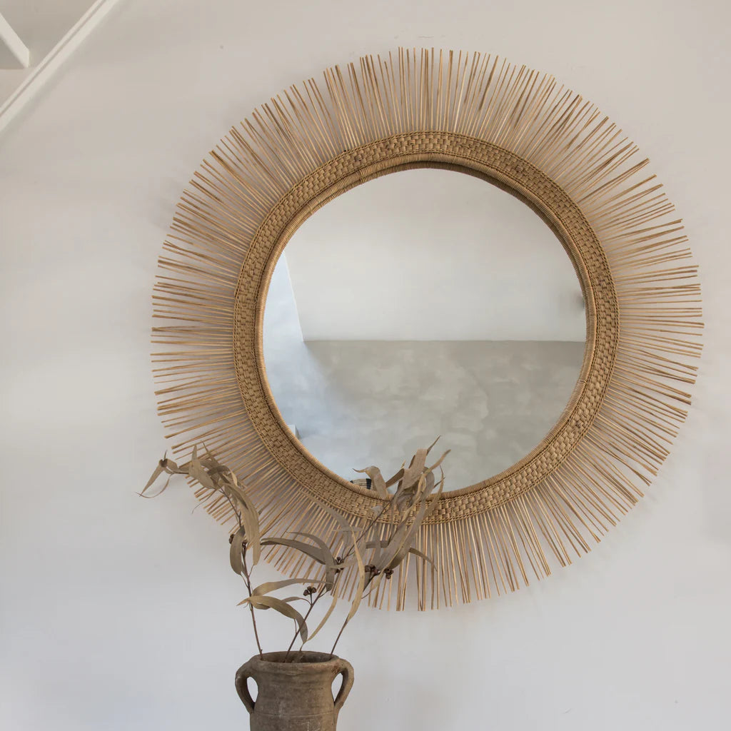 This Malawi mirror captures the essence of the rising sun and makes for a stunning addition to any living space. Crafted with care from rattan and bamboo, it takes inspiration from the iconic Malawi Chair. The intricate frame showcases a fusion of indigenous craftsmanship and Scandinavian sophistication, making it a must-have piece. The mirror comes with a wireframe for easy hanging and is ready to be displayed.